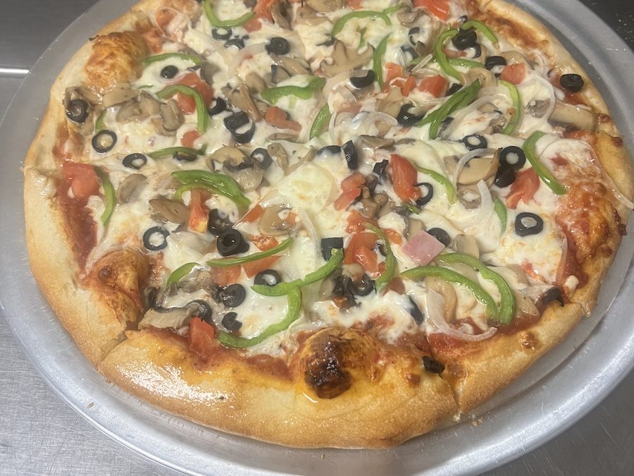 Veggie pizza with olives, mushroom, tomato and peppers